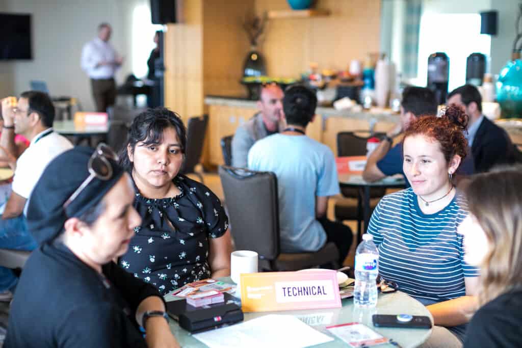 Group of women event attendees networking in the meeting hall