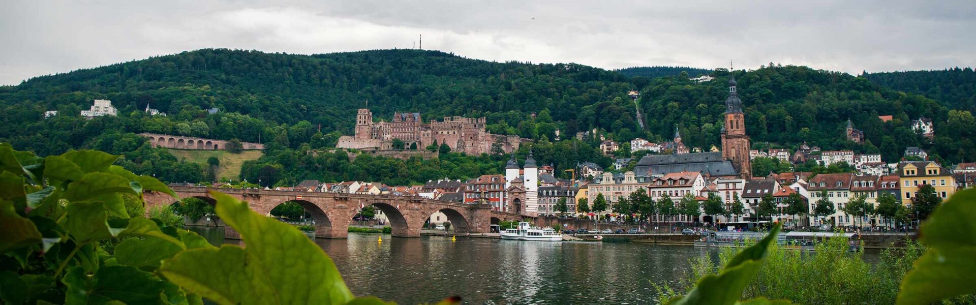 View overlooking Heidelberg Germany from across the river, with a castle in the background.