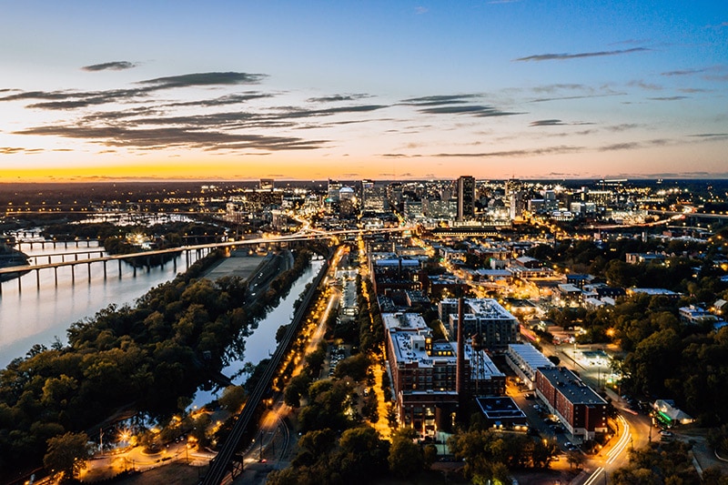 overhead view of the city of Richmond and the bridges over the water at sunset.