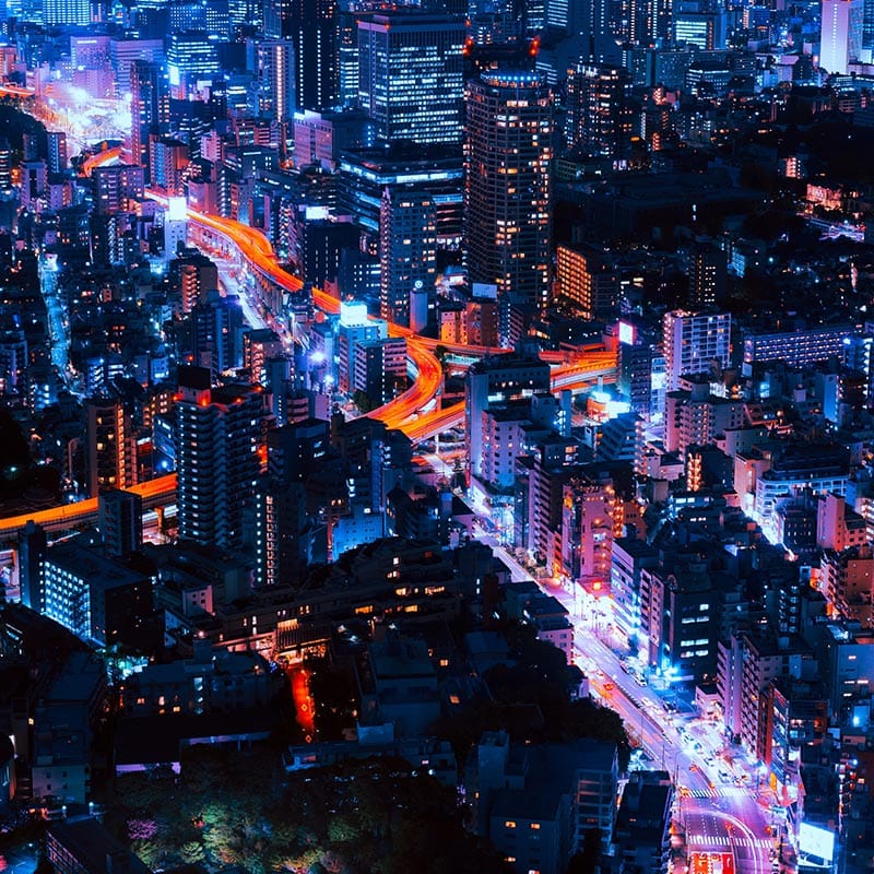 Overhead view of the city of Tokyo at night.