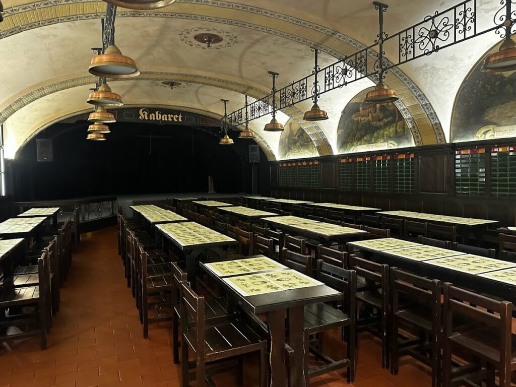 Interior of U Fleků Brewery and Restaurant, with tables set up in the dining area