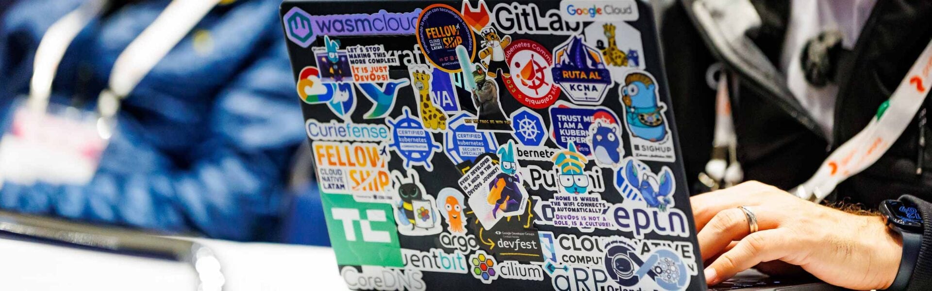 A laptop covered in stickers.