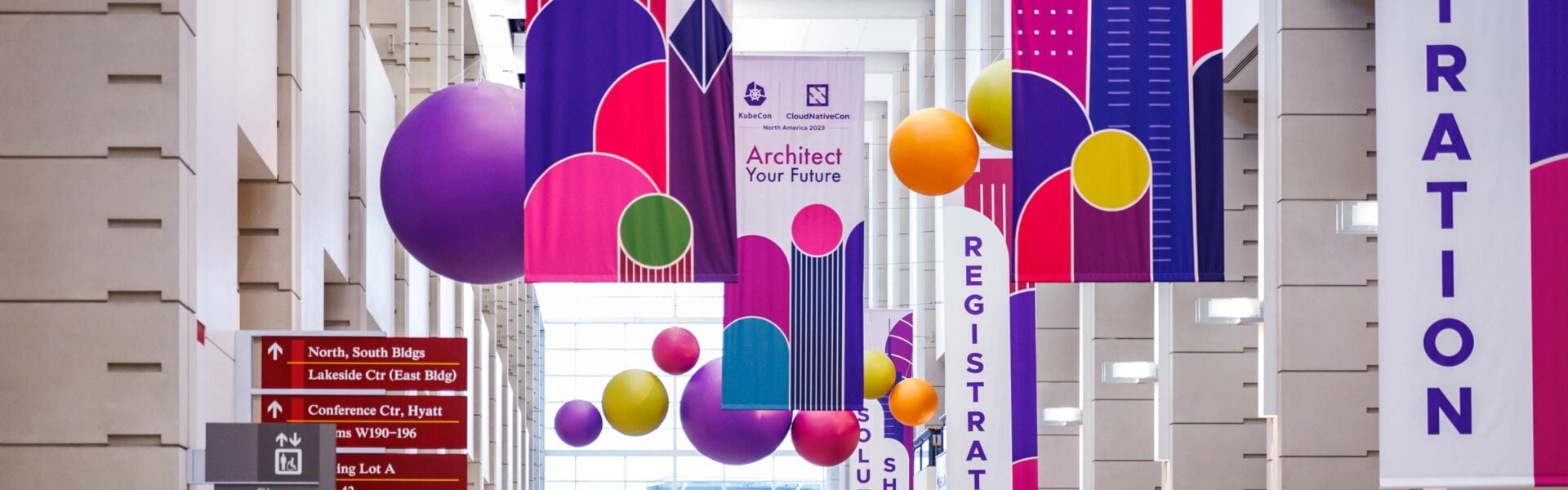 Banners & signage hanging from the walls & ceilings with colorful decorations.