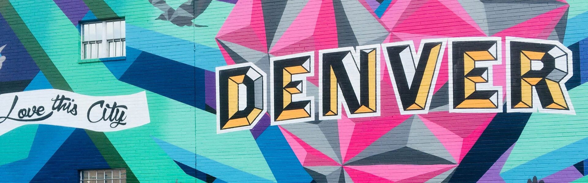 A colorful mural that says "Love this City" and "Denver."
