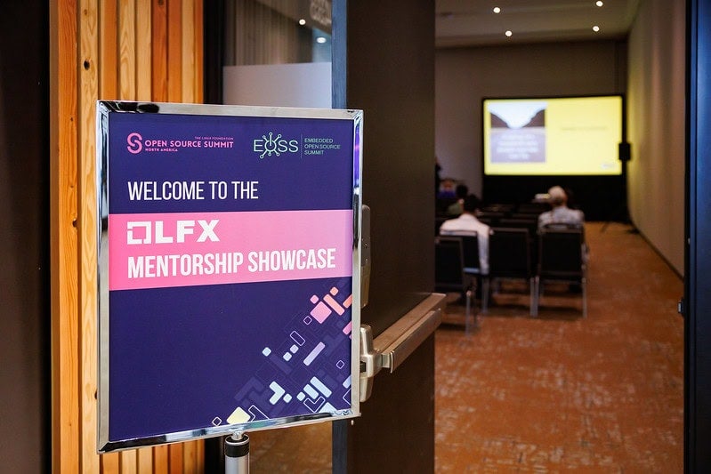 A sign that reads "Welcome to the LFX Mentorship Showcase".
