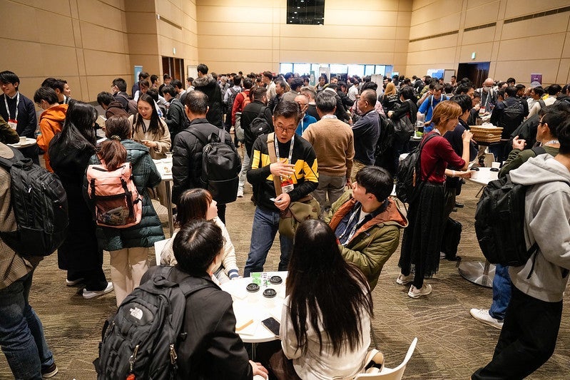 A large group of attendees gathered for refreshments.