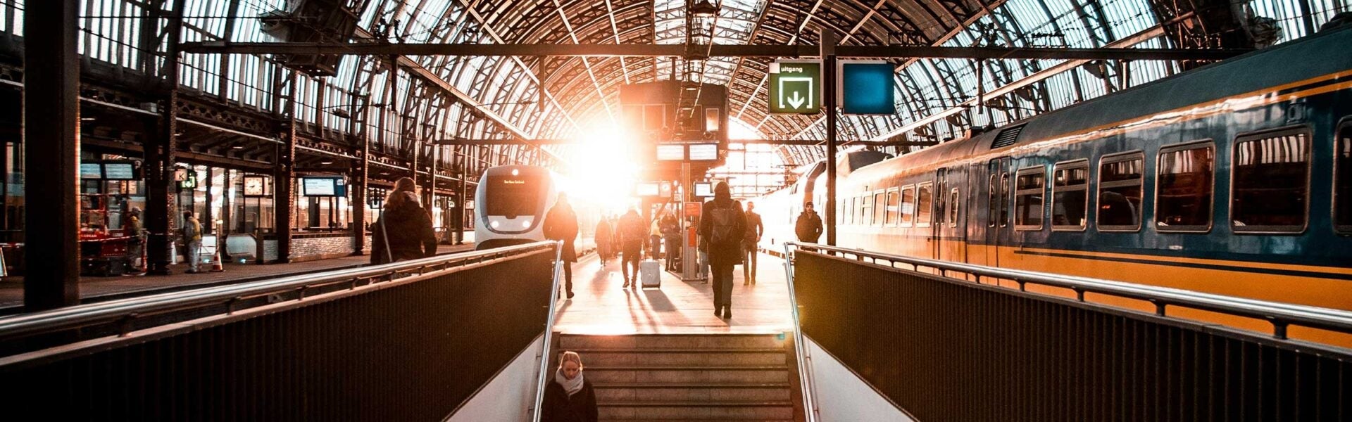 The sun coming through the windows at the Amsterdam Train Station.