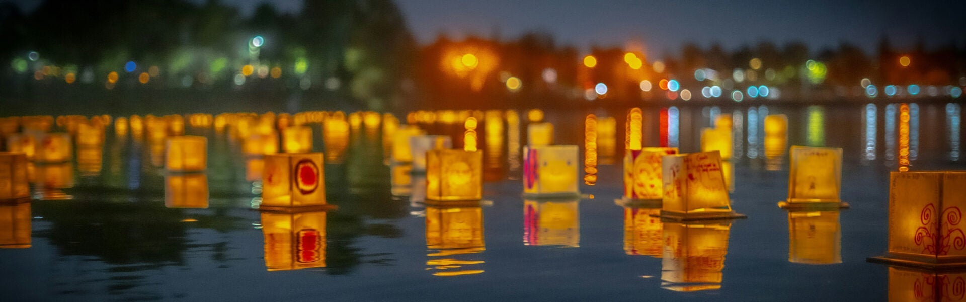 Lanterns floating on water.