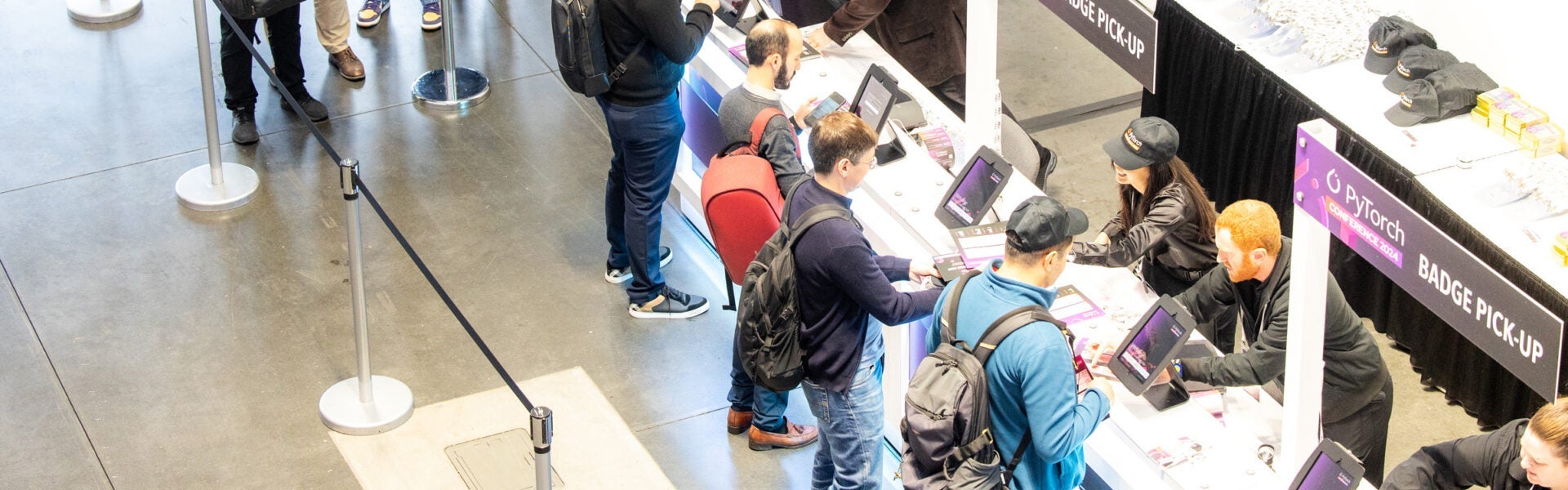 People at a registration desk.