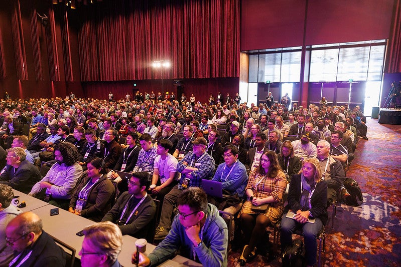 A room full of people seated.