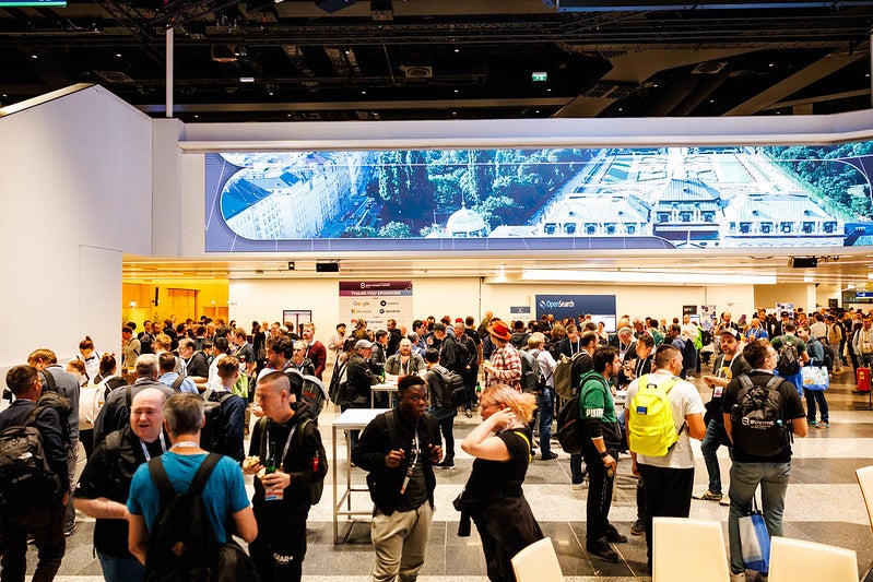 A room full of people mingling.