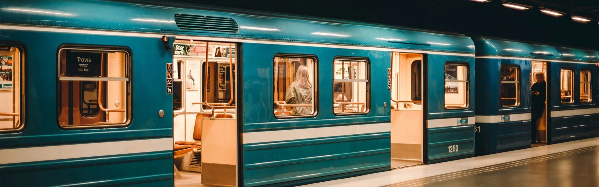 A subway train parked at a station.