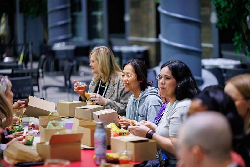 A group of women having lunch and talking.