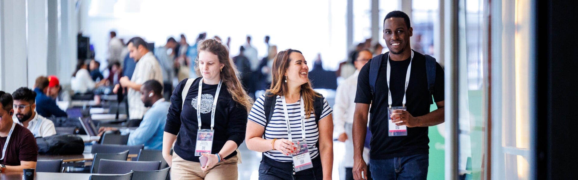 Attendees chatting while walking between sessions.