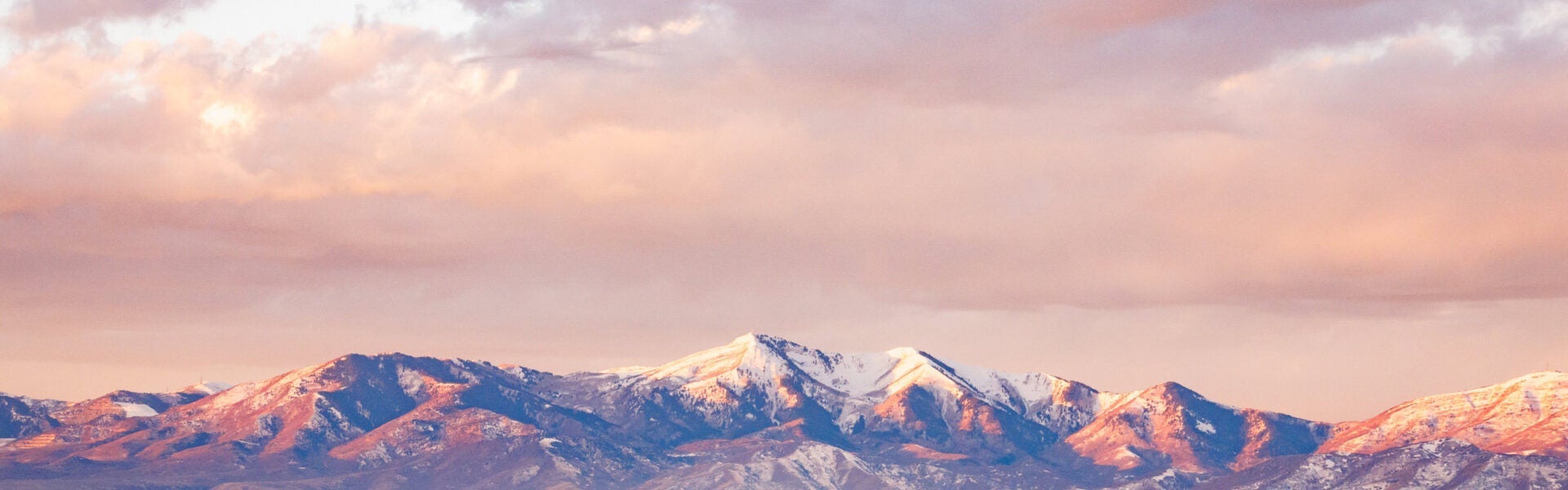 snowcapped mountains at sunset.